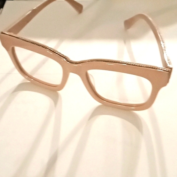 Stella mcCartney muted rose glasses with silver chain embellishment.